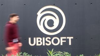 A man walks past the logo at main entrance of video production company Ubisoft where a 3-day strike is taking place in Montpellier, southern France on October 15, 2024. No more playing at Ubisoft: employees are mobilizing for a three-day strike, the second this year, as the French video game giant goes through a difficult time with slumping sales and the postponement of a major game, against a backdrop of rumors of a takeover of the company. (Photo by Pascal GUYOT / AFP) (Photo by PASCAL GUYOT/AFP via Getty Images) 