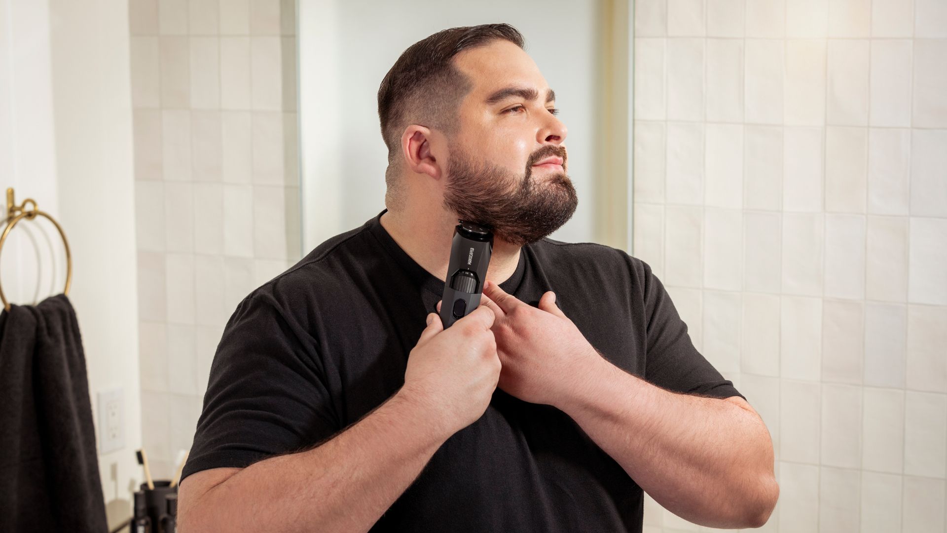 an image of a man shaving his beard