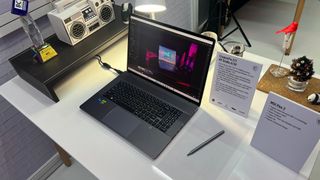 An MSI Creator laptop on a desk with an MSI Pen