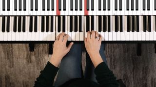 Overhead shot of hands on a keyboard