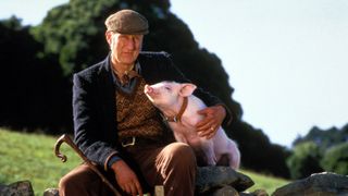 James Cromwell sits with Babe the pig