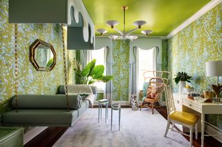 palm beach style green sitting room with hanging bed