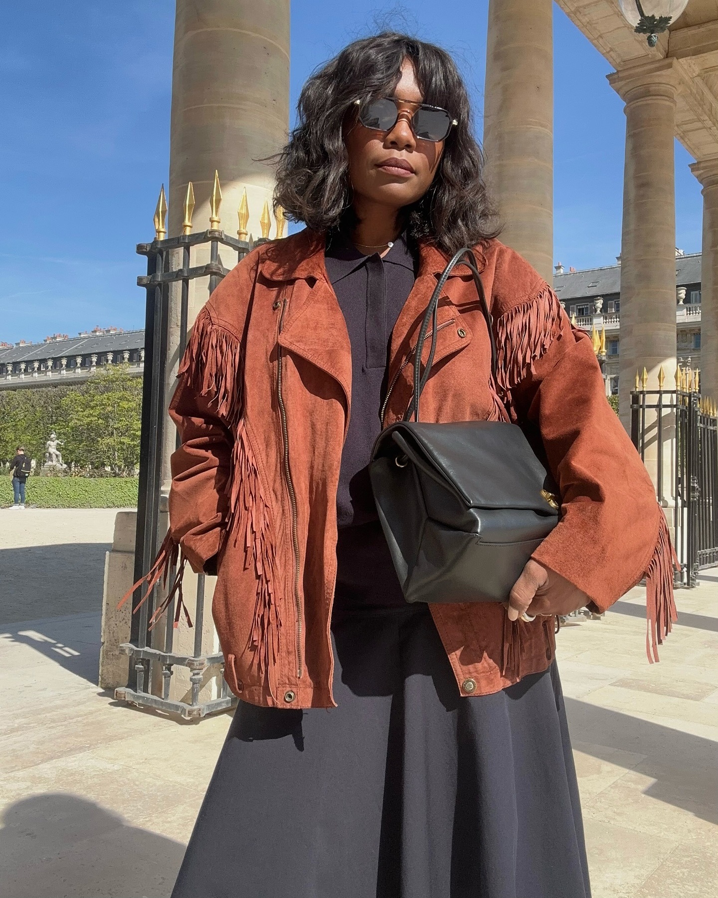 A woman in Paris with a soft bob hairstyle