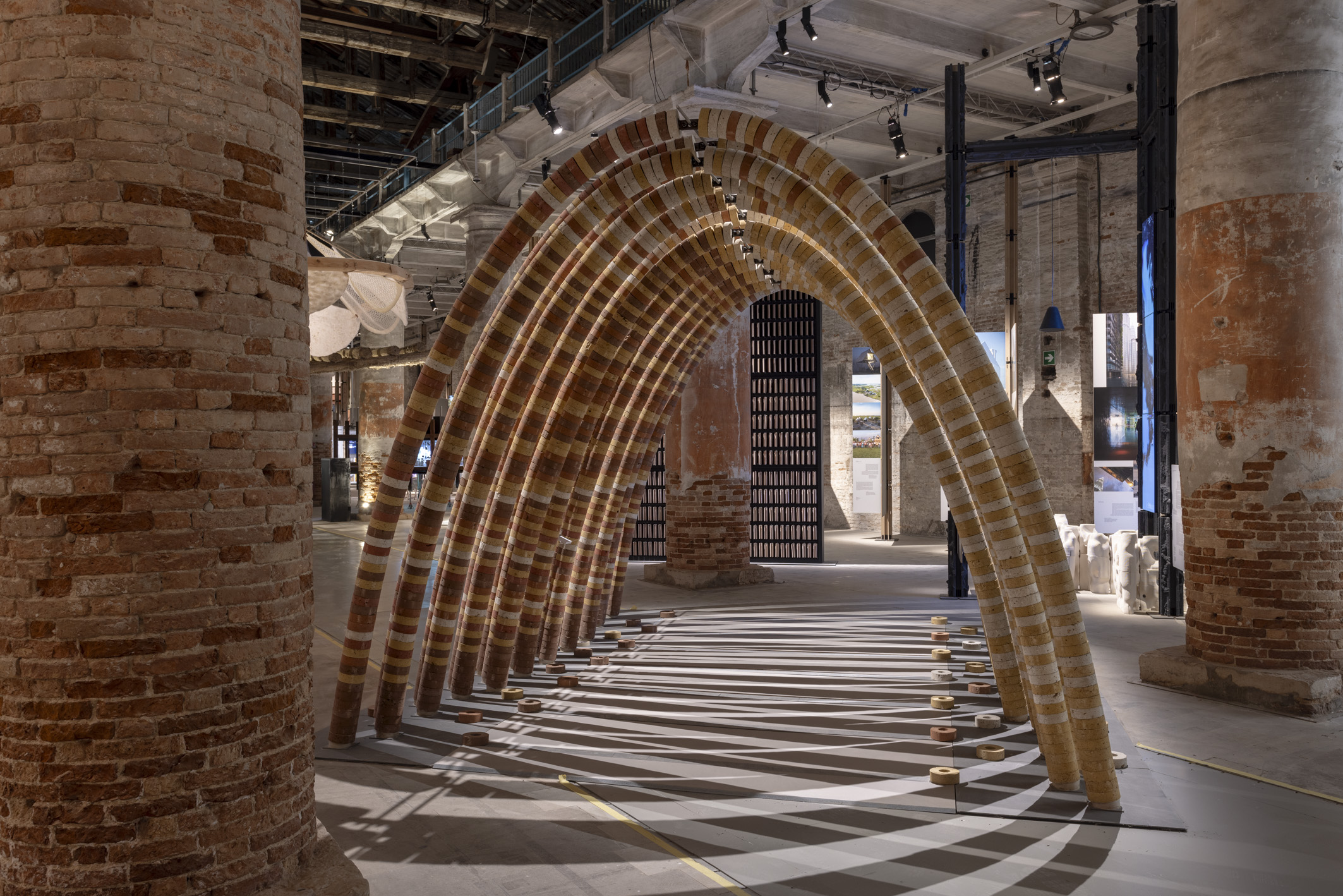 installation views within the arsenale rooms of Intelligens, the main show at venice architecture biennale 2025
