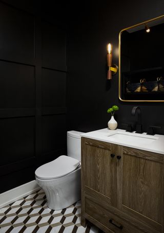 black powder room by Devon Grace Interiors