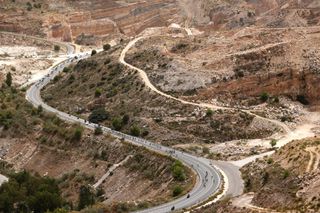 VELEFIQUE SPAIN AUGUST 22 The peloton passing through a landscape during the 76th Tour of Spain 2021 Stage 9 a 188 km stage from Puerto Lumbreras to Alto de Velefique 1800m lavuelta LaVuelta21 on August 22 2021 in Velefique Spain Photo by Gonzalo Arroyo MorenoGetty Images