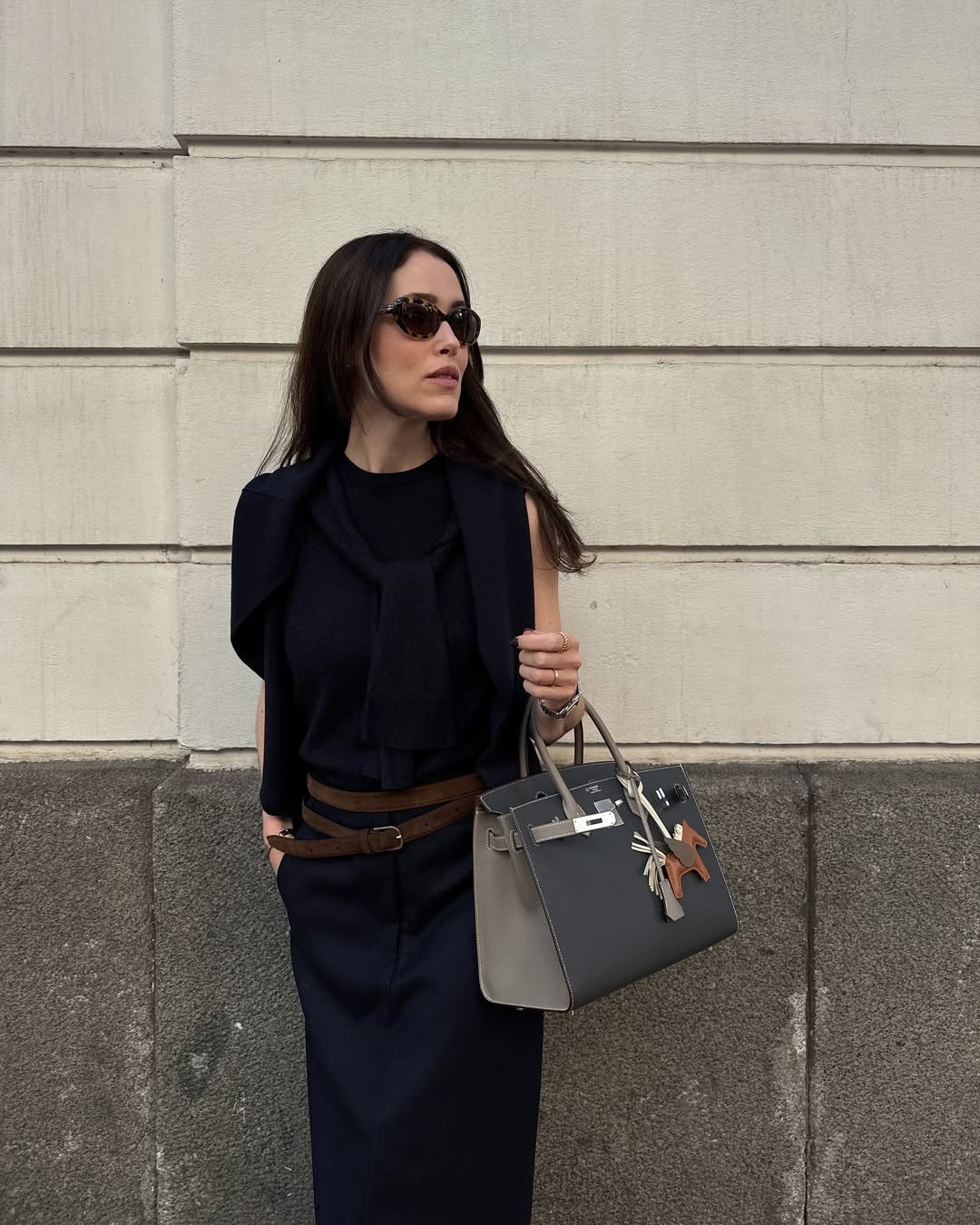 All navy outfits - influencer wearing knitted vest + maxi skirt