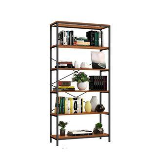 An industrial bookcase with decor on it