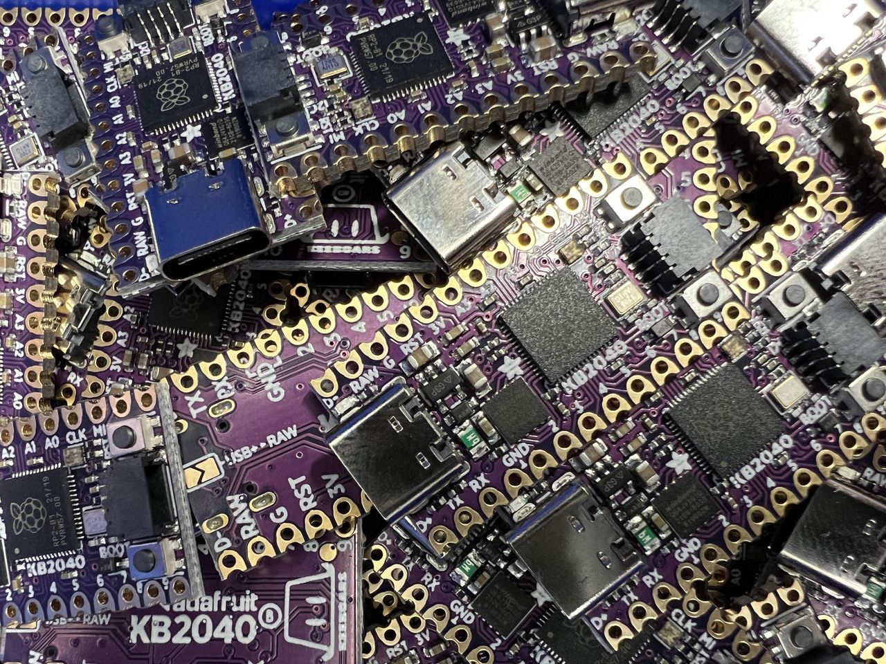 A stack of Adafruit KB2040 boards