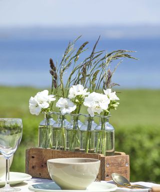white geraniums in summer table display