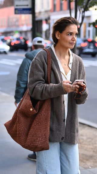 Katie Holmes is seen on her way to the theatre in jeans and a Dune London bag on October 10, 2024 in New York City