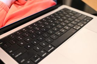 Angled topdown photo of MacBook Pro 14-inch (M3, 2023) to show keyboard and touchpad