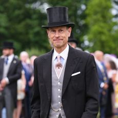 Prince Edward wearing a suit and top hat