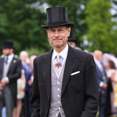 Prince Edward wearing a suit and top hat