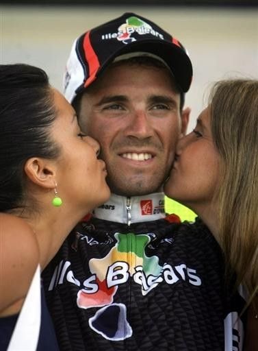 Stage winner Alejandro Valverde (Caisse d'Epargne-Illes Balears) receives some podium delights.