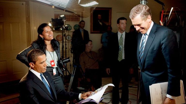 Barak Obama reading the news