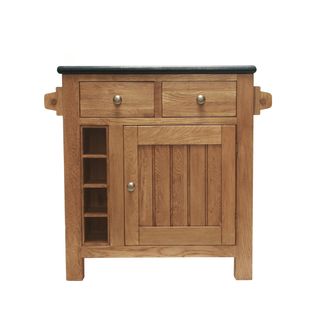 A granite top butchers block with wooden drawers and cupboard doors