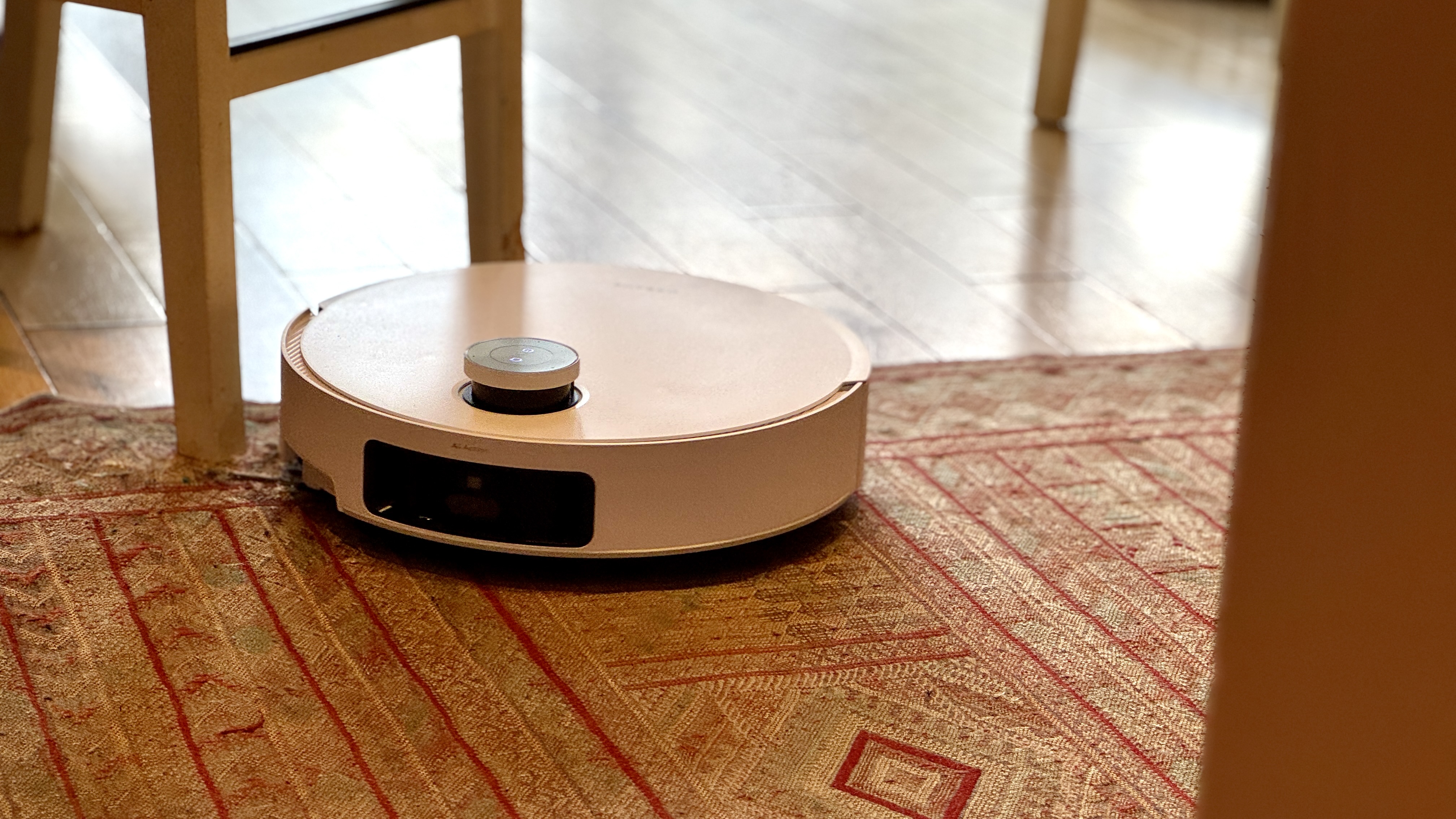 Dreame Matrix10 Ultra robot vacuum cleaning a carpet-like rug