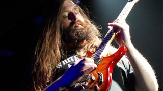 ALL THAT REMAINS; Oli Herbert performing live on stage
