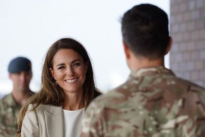Kate Middleton outfit at BRIZE NORTON, ENGLAND - SEPTEMBER 15: Catherine, Duchess of Cambridge arrives to meet those who supported the UK's evacuation of civilians from Afghanistan, at RAF Brize Norton on September 15, 2021 in Brize Norton, England. Operation PITTING, the largest humanitarian aid operation for over 70 years, ran between 14th and 28th August, where in excess of 15,000 people were flown out of Kabul by the Royal Air Force. (Photo by Chris Jackson/Getty Images)