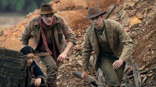 Moriarty and Sherlock run through a desert ground