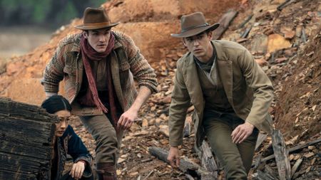 Moriarty and Sherlock run through a desert ground