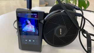 Astell & Kern A&norma SR35 and FiiO FT5 on a table