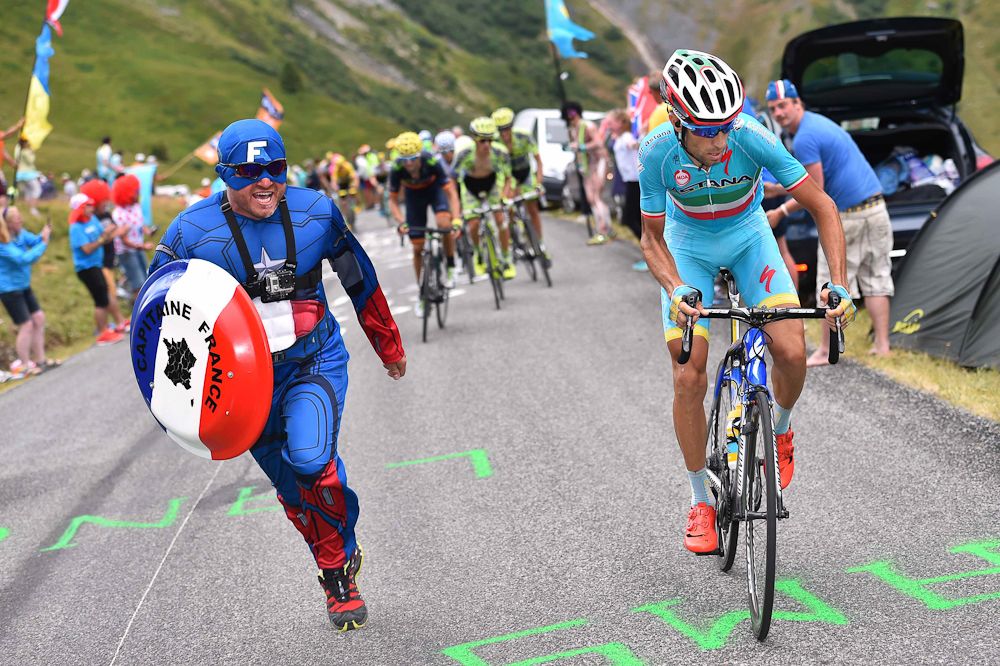 Captain America runs alongside Vincenzo Nibali during stage 19.