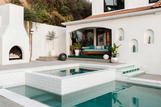 a moroccan inspired backyard pool and porch