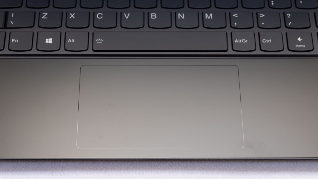 A photograph of the Lenovo Yoga 9i 14in (Shadow Black)'s touchpad