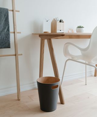 Trash can in office, wooden ladder
