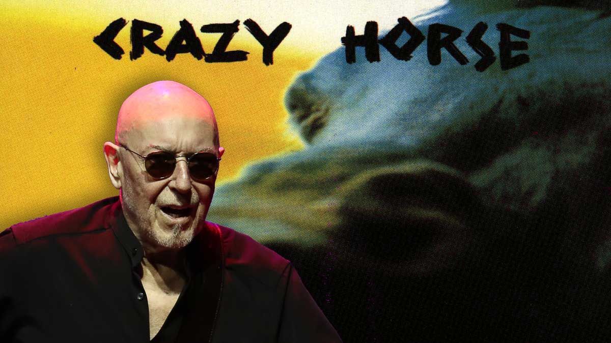 Pete Agnew looking angry in front of the cover artwork of Crazy Horse&#039;s debut album