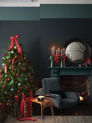 Christmas tree with red bows in dark grey living room by Benjamin Moore