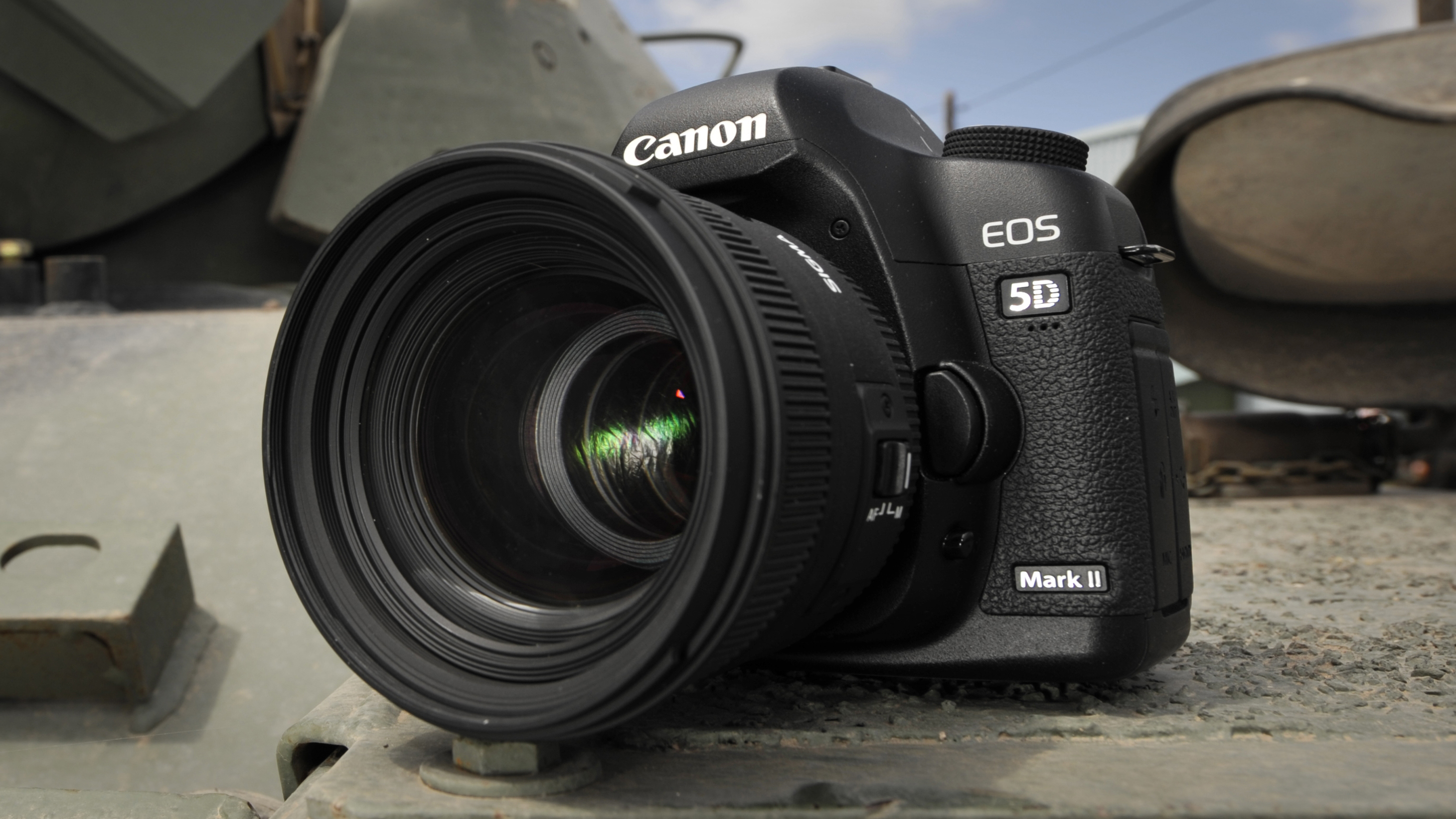 Canon EOS 5D Mark II on a metal surface, outdoors