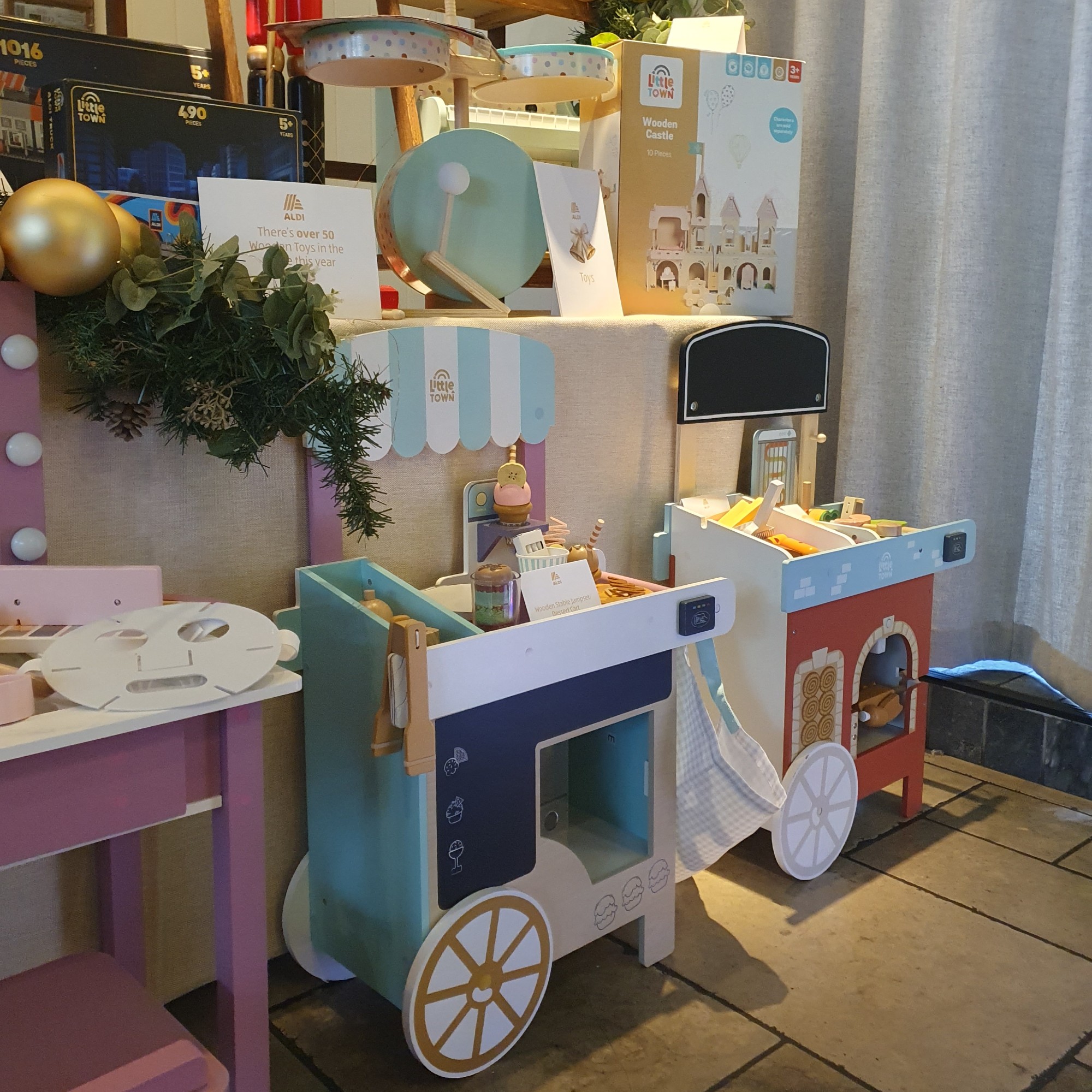 Aldi's wooden toy food carts displayed at the retailer's Christmas press preview for 2026