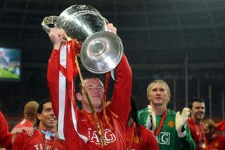 Rooney celebrates with the Champions League trophy