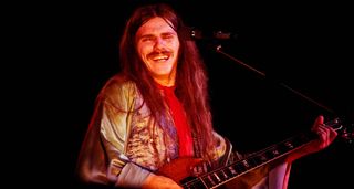 Frank Marino smiles onstage with his Gibson SG in this archive colour photo from 1976