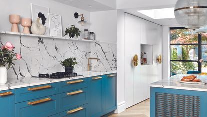 Green shaker kitchen with open shelving