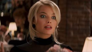 Margot Robbie looking shocked in The Wolf of Wall Street.