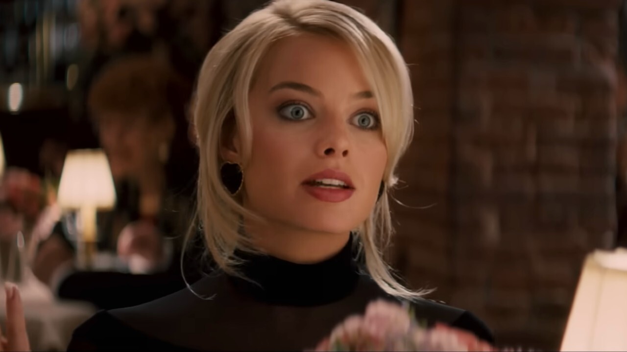 Margot Robbie looking shocked in The Wolf of Wall Street.