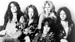 Photo of AEROSMITH and Joe PERRY and Tom HAMILTON and Steven TYLER and Brad WHITFORD and Joey KRAMER; L-R: Joe Perry, Brad Whitford, Steven Tyler (front), Tom Hamilton (back), Joey Kramer - posed, studio, group shot 