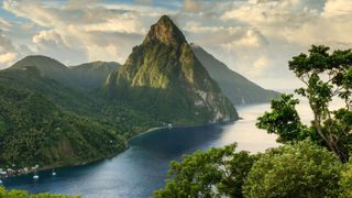 One of the pitons at St Lucia - a volcani cone covered in greenery and surrounded by sea