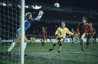 Belgium's Jean-Marie Pfaff saves a shot from Scotland's Ally McCoist in a qualifier in 1987.