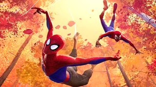 Two Spider-Men flying through the air during one of the best superhero movies, Spider-Man: Into the Spider-Verse.