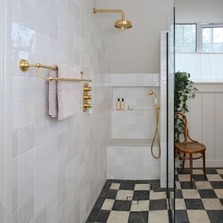wet room with shower area and checkerboard flooring ripples