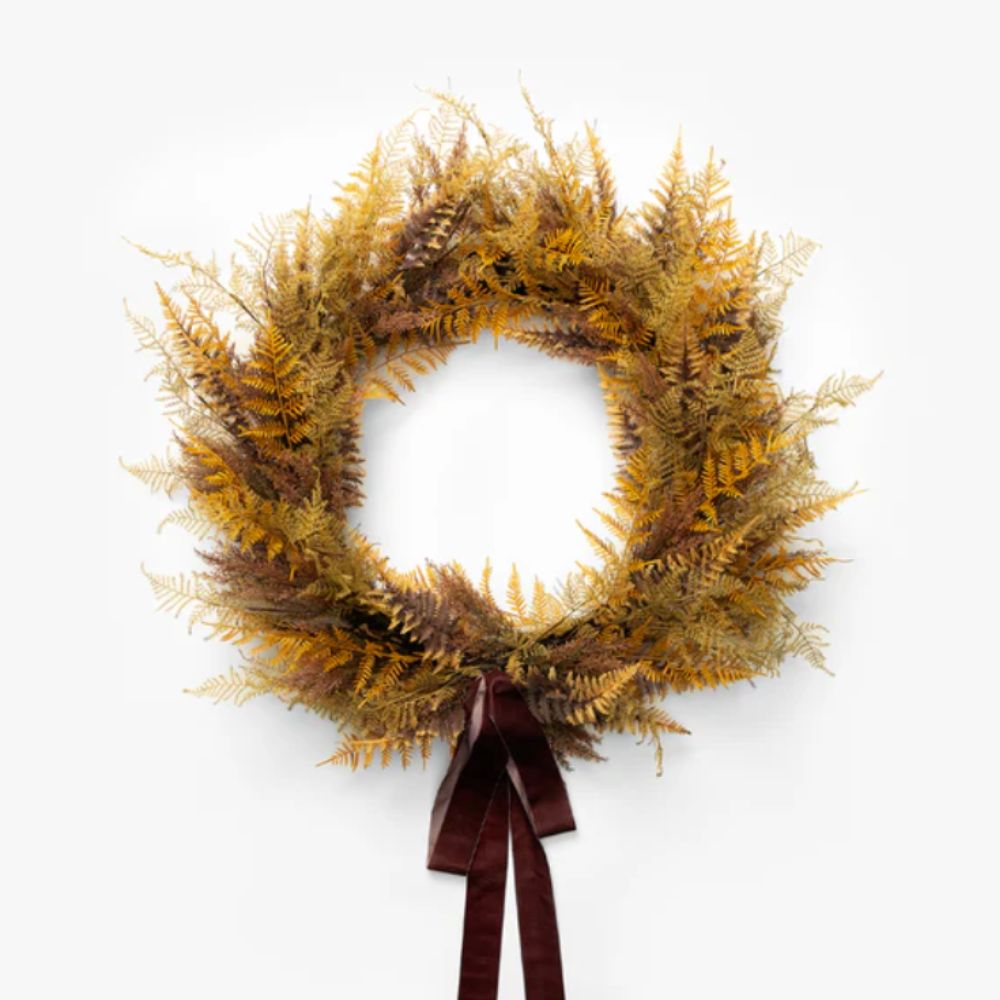 Golden fern faux wreath with brown ribbon 