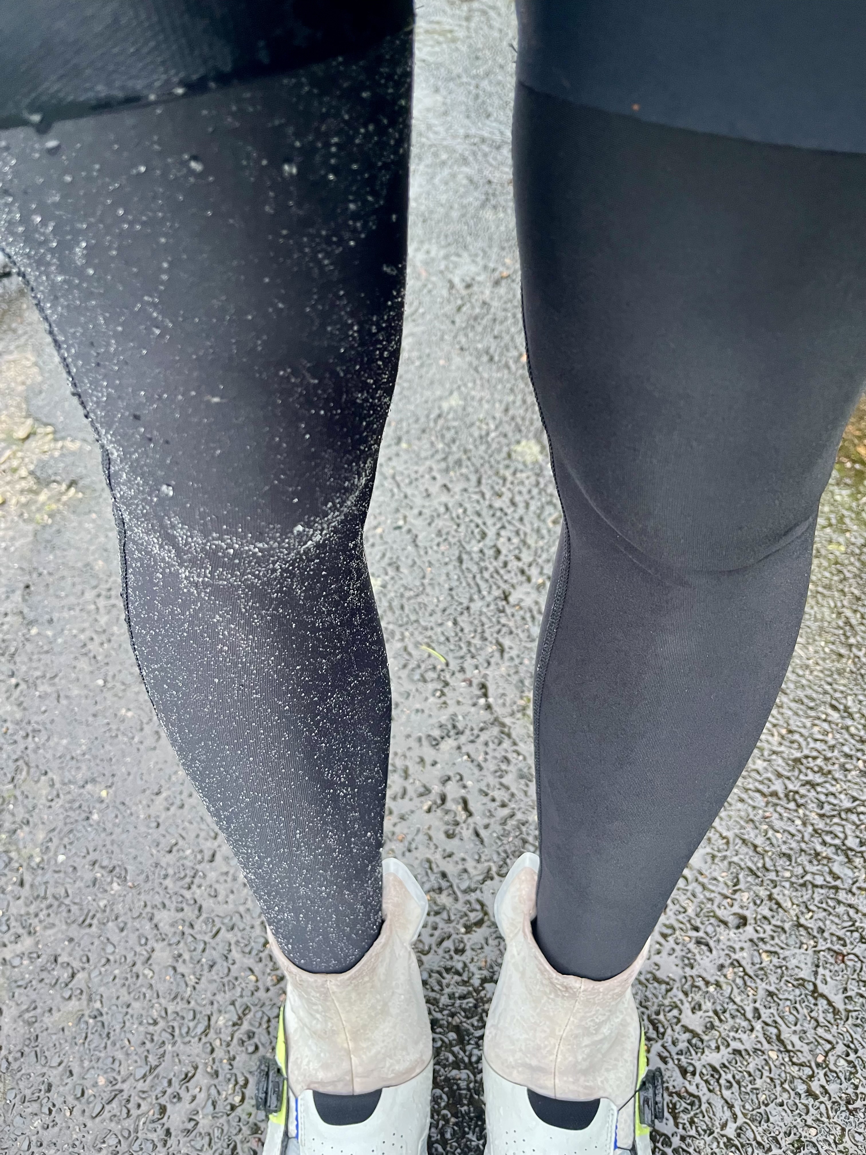 A man wearing two different leg warmers