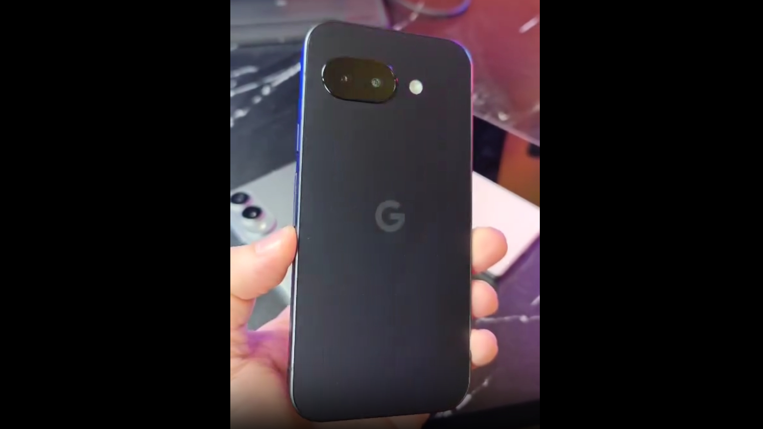 A device that may be the Google Pixel 9a, rear panel visible