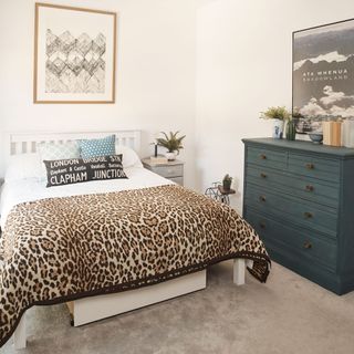bedroom with double bed and leopard bedsheet