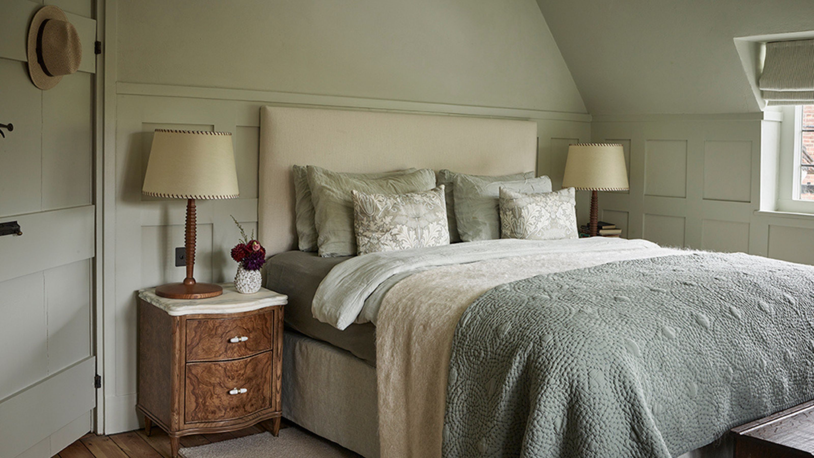 a soft gray green main bedroom in a cottage home in hampstead, london